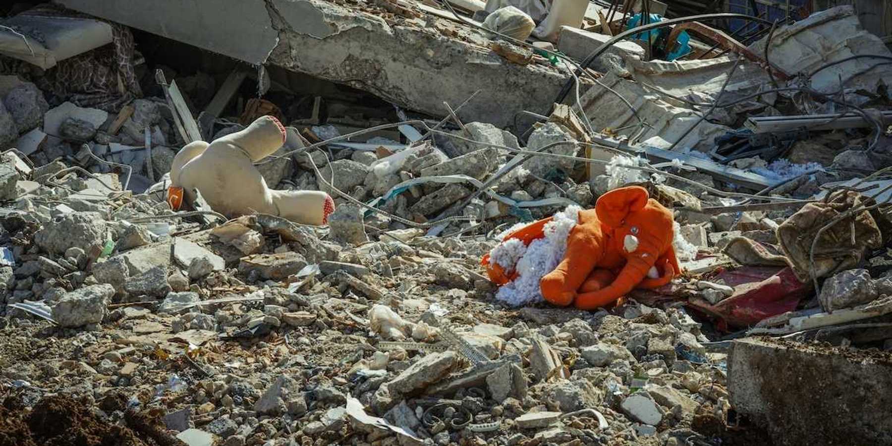 Rubble and stuffed child's toys in the aftermath of a destructive flood