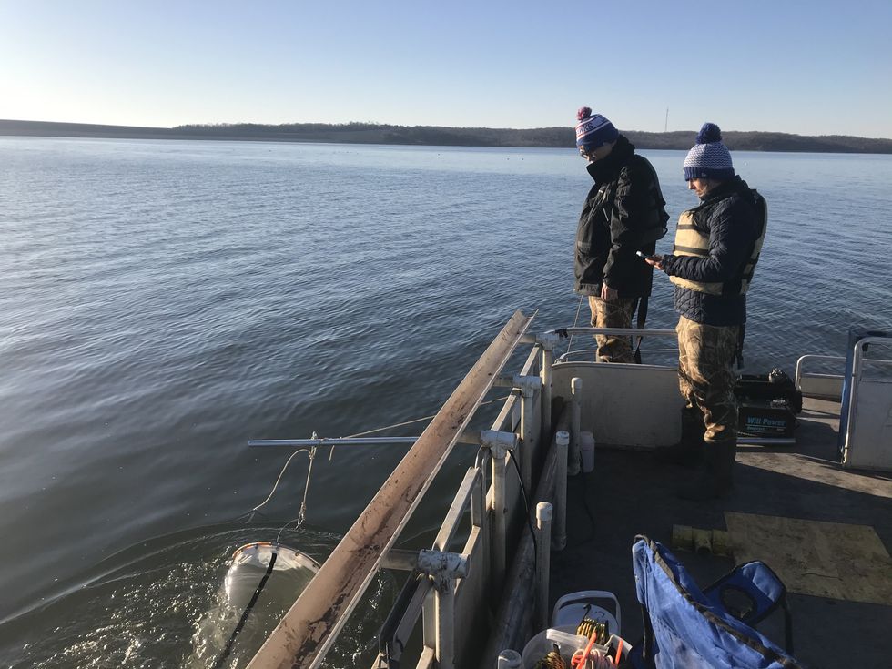 sampling lake water in Kansas