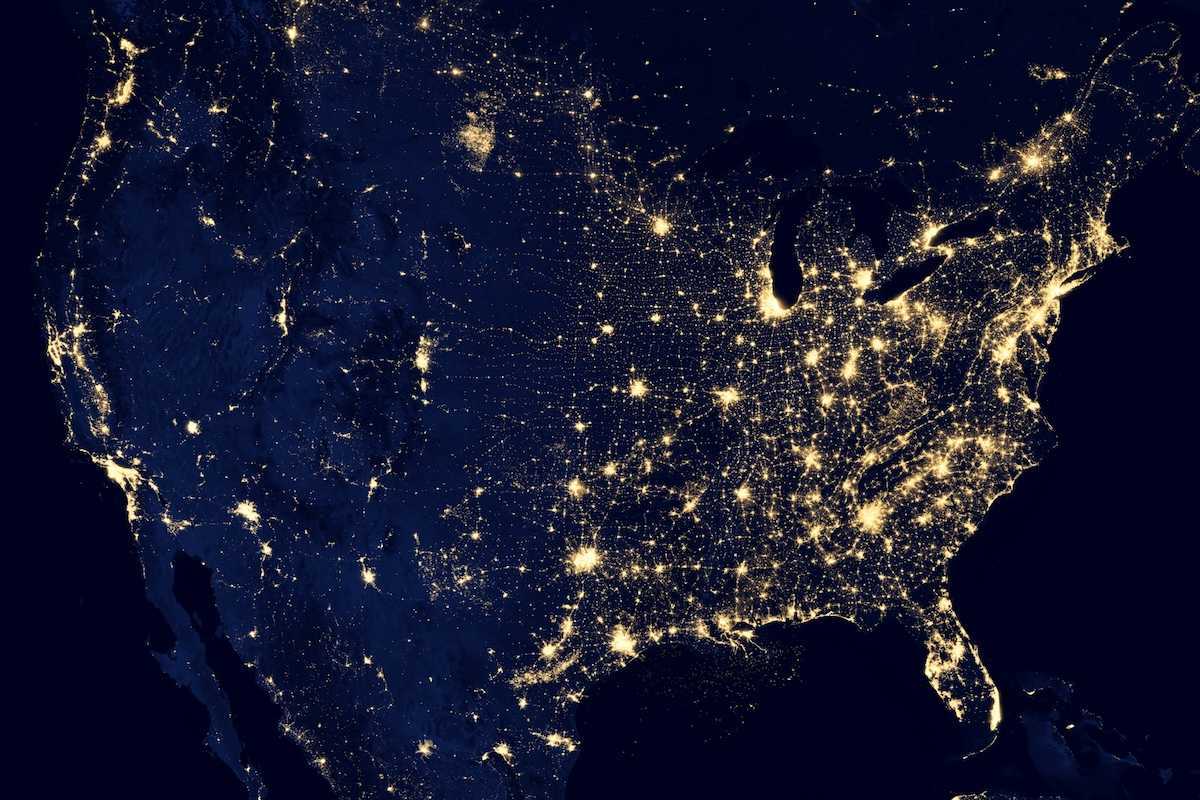 Satellite map of the continental US taken at night showing lights from major metropolitan areas