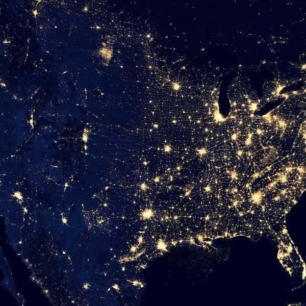 Satellite map of the continental US taken at night showing lights from major metropolitan areas