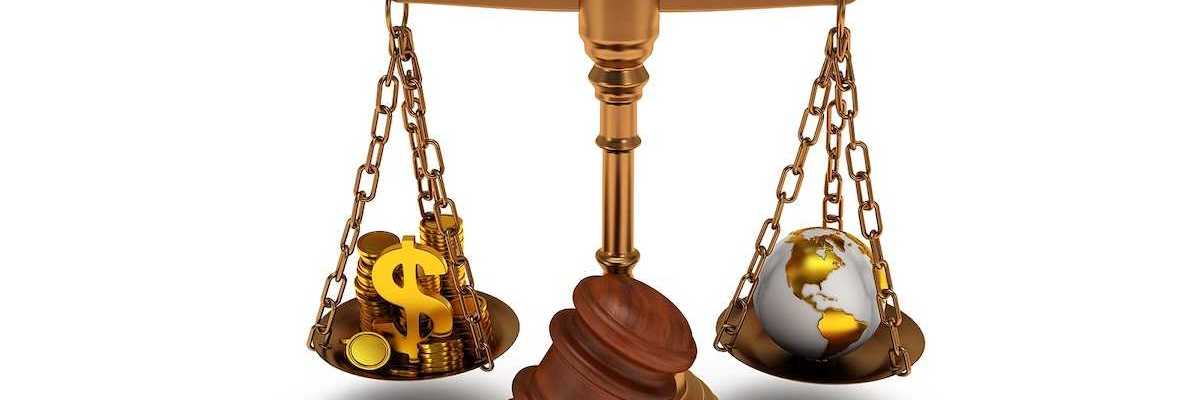 Scales of justice depicting wealth balanced against earth globe.