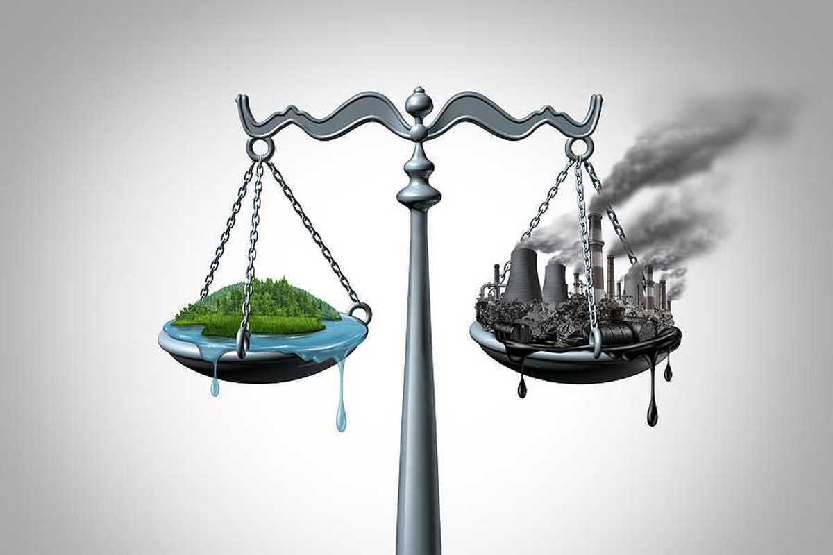 Scales of justice with a harmonious green ecosystem on one side and a dirty polluted fossil fuel plagued industrial site on the other scale.