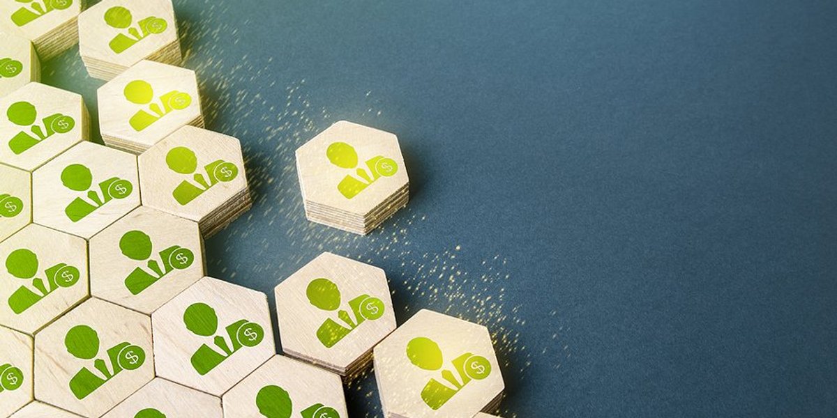 small puzzle with an image of a man and money sign