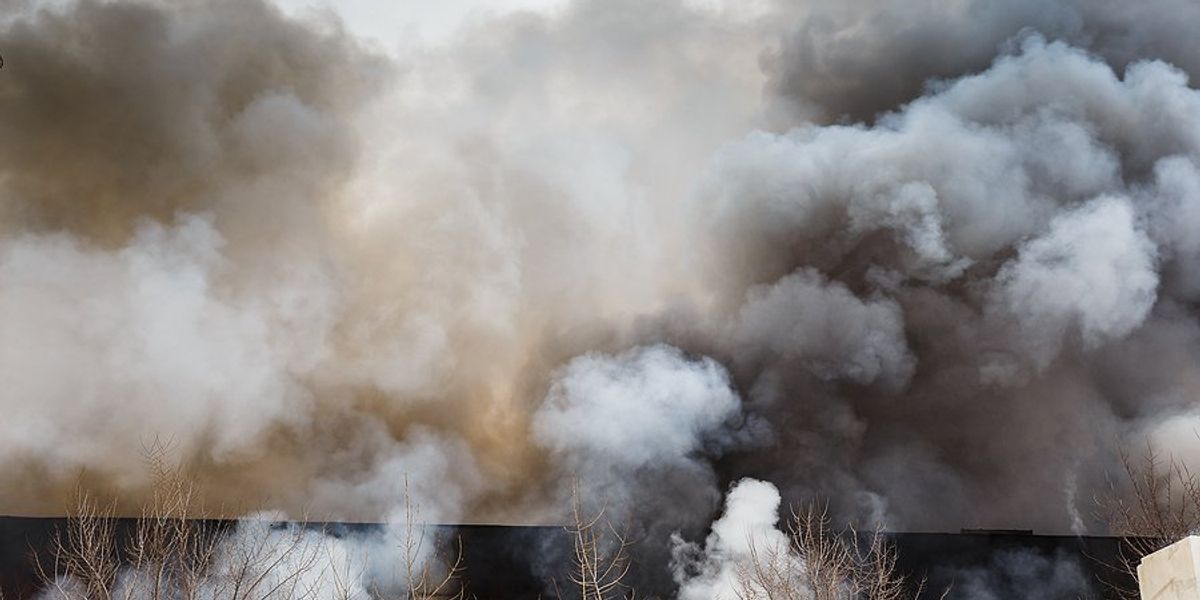 Smoke billowing from a building fire.