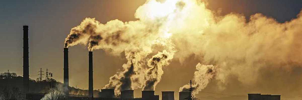Smokestacks spewing air pollution from a power plant