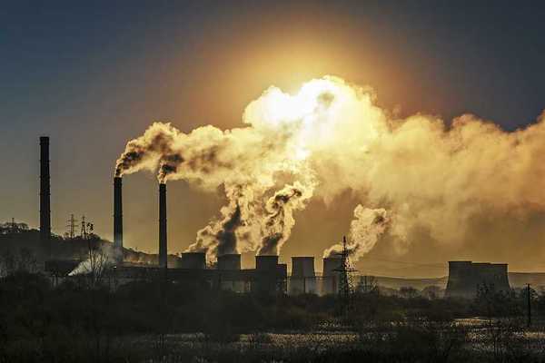 Smokestacks spewing air pollution from a power plant