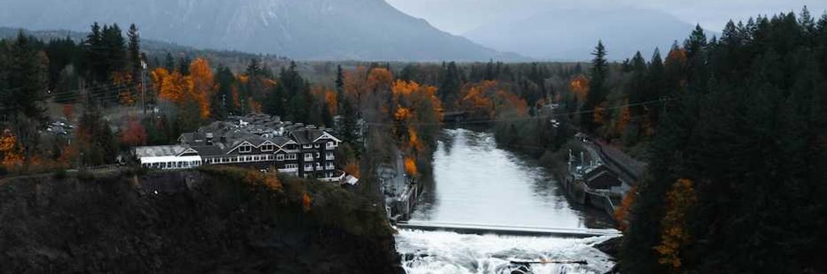 Snoqualmie Falls, Snoqualmie, WA, USA with North Cascade Mountains in background