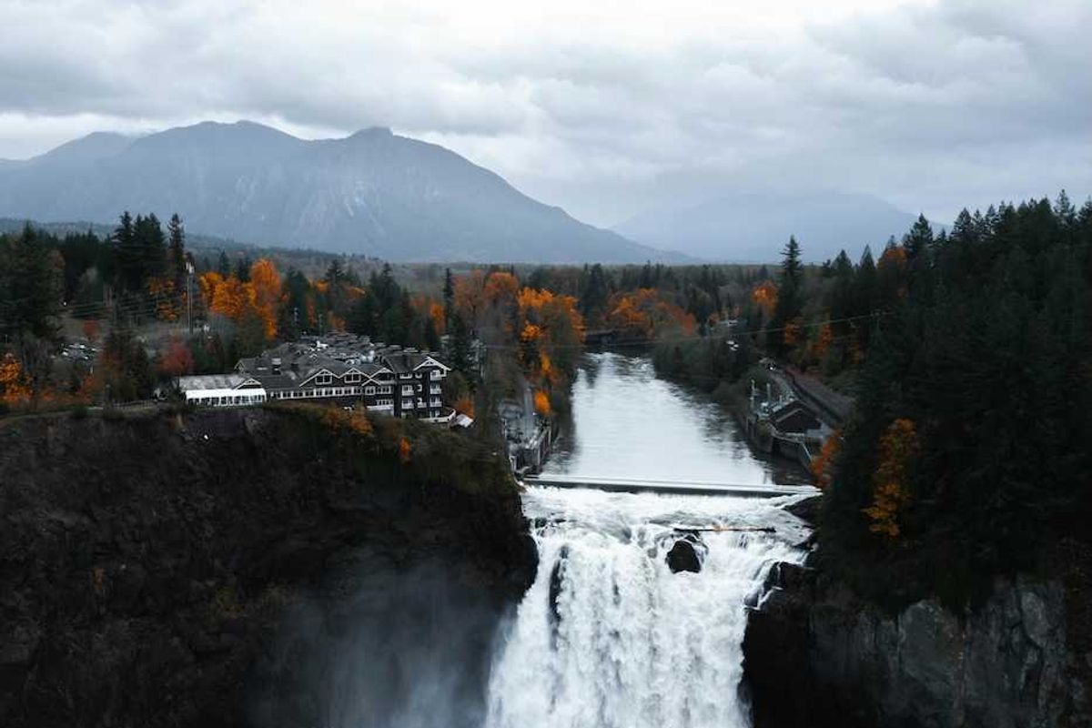 Snoqualmie Falls, Snoqualmie, WA, USA with North Cascade Mountains in background