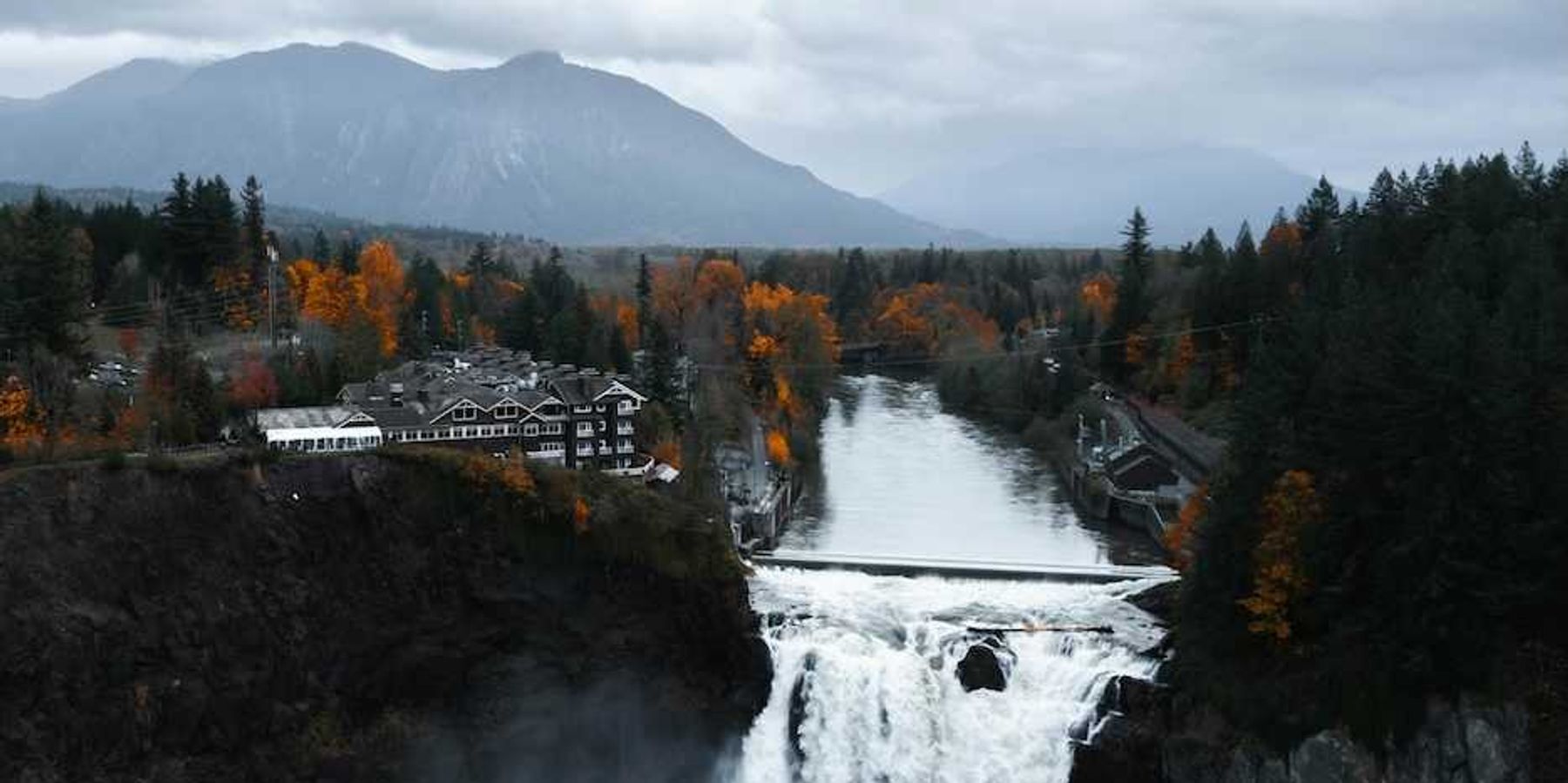 Snoqualmie Falls, Snoqualmie, WA, USA with North Cascade Mountains in background