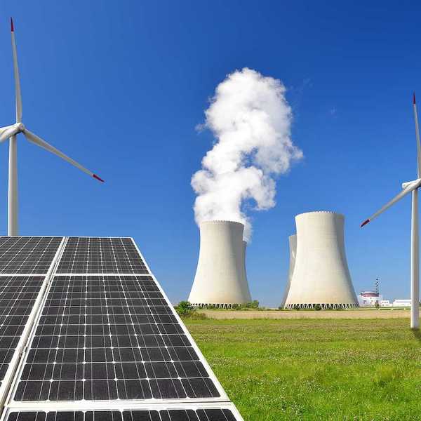 Solar panel, wind turbines, and cooling towers from a power plant