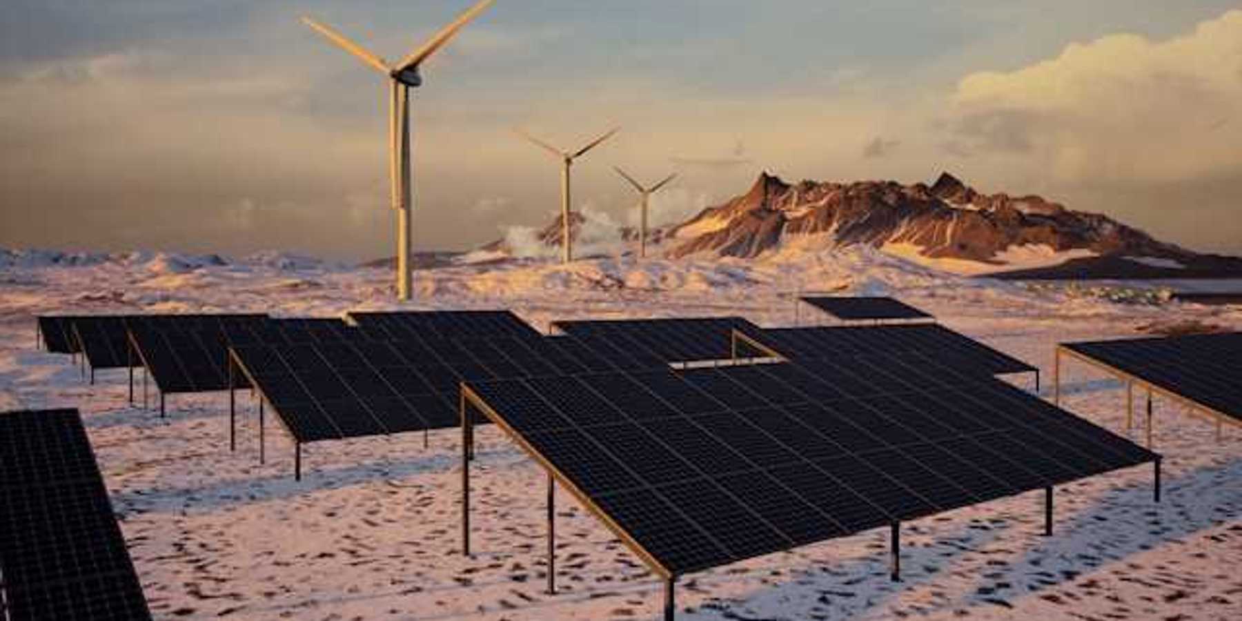 Solar panels and wind turbines in a snowy landscape