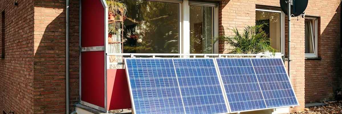 Solar panels installed on a city balcony, generating solar energy.