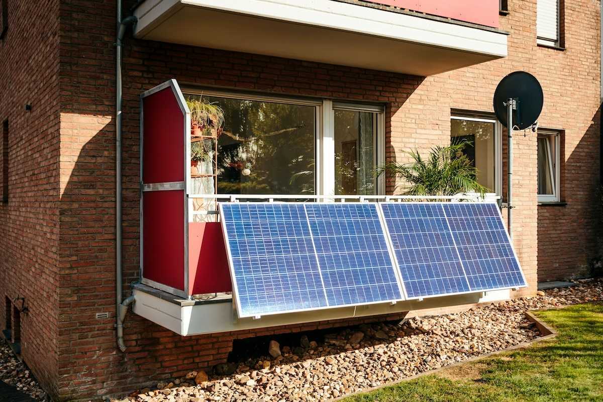 Solar panels installed on a city balcony, generating solar energy.