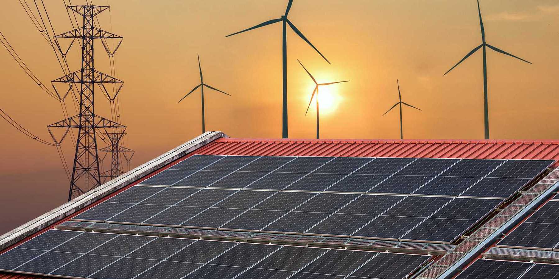 Solar panels juxtaposed against transmission lines and wind turbines