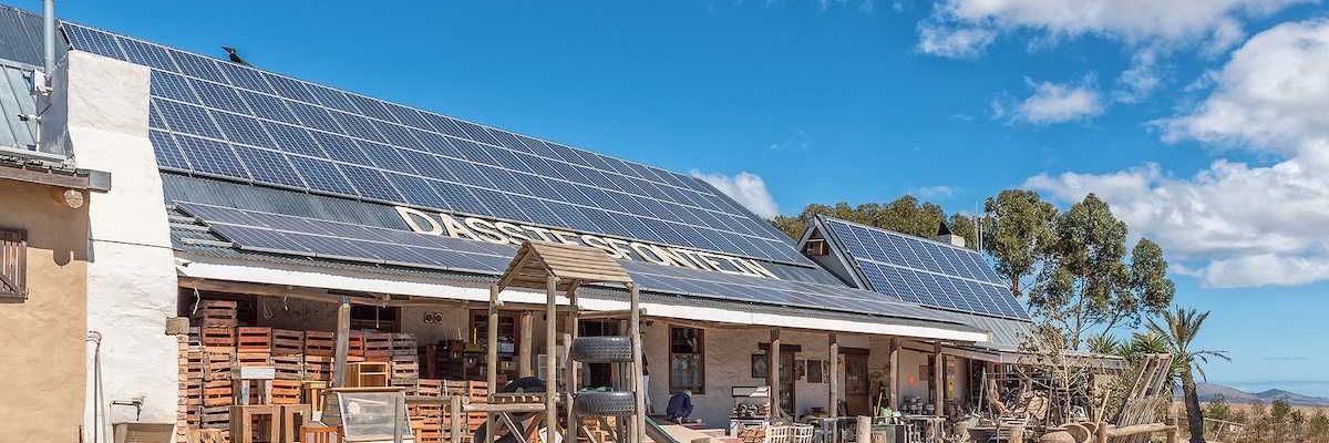 Solar panels on the roof of a roadside business establishment in South Africa