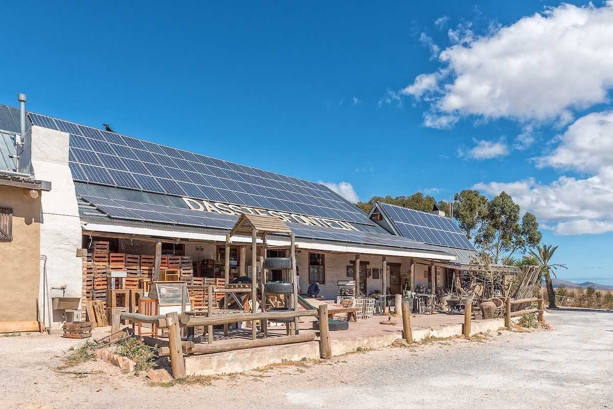Solar panels on the roof of a roadside business establishment in South Africa