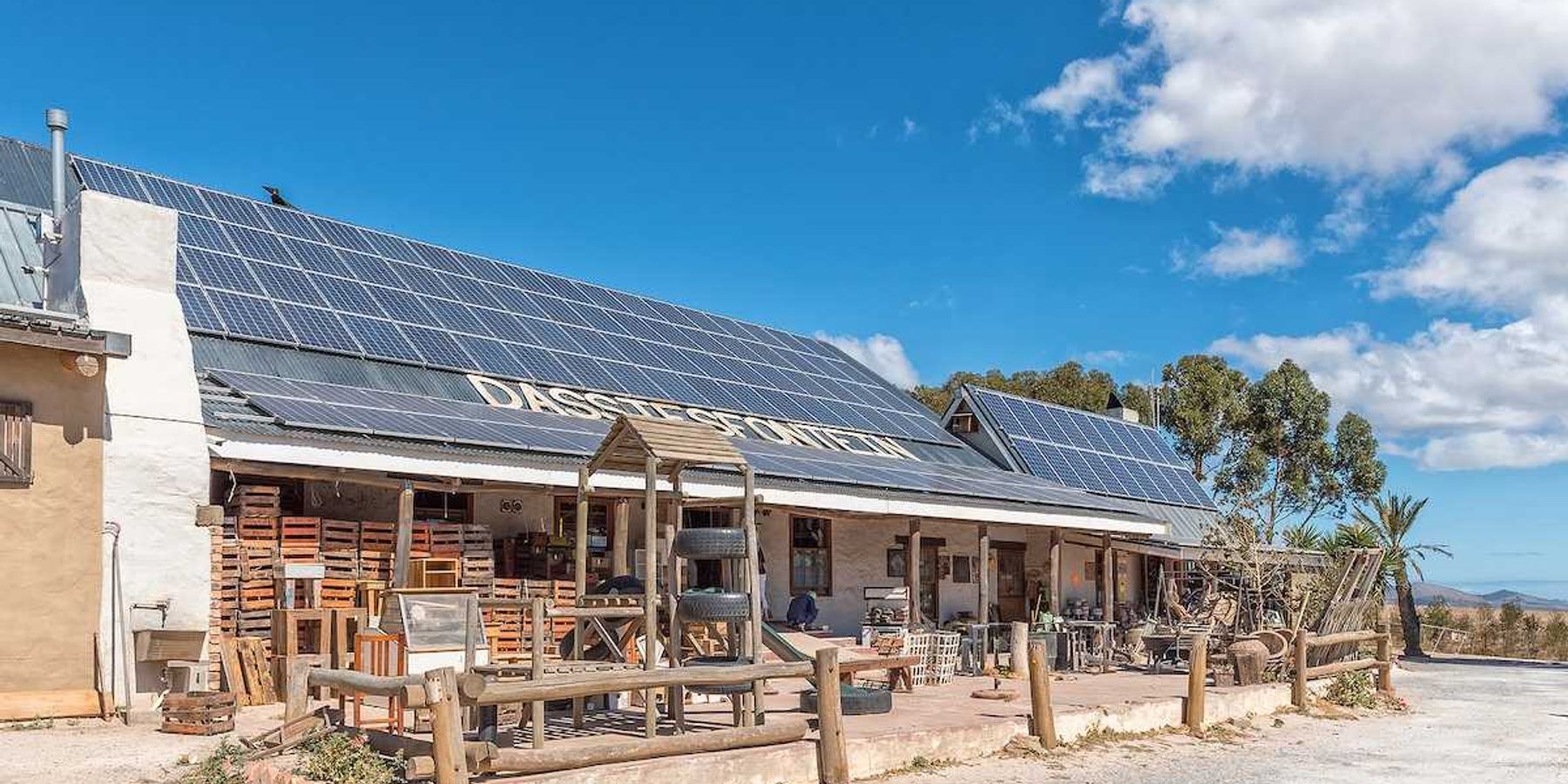 Solar panels on the roof of a roadside business establishment in South Africa
