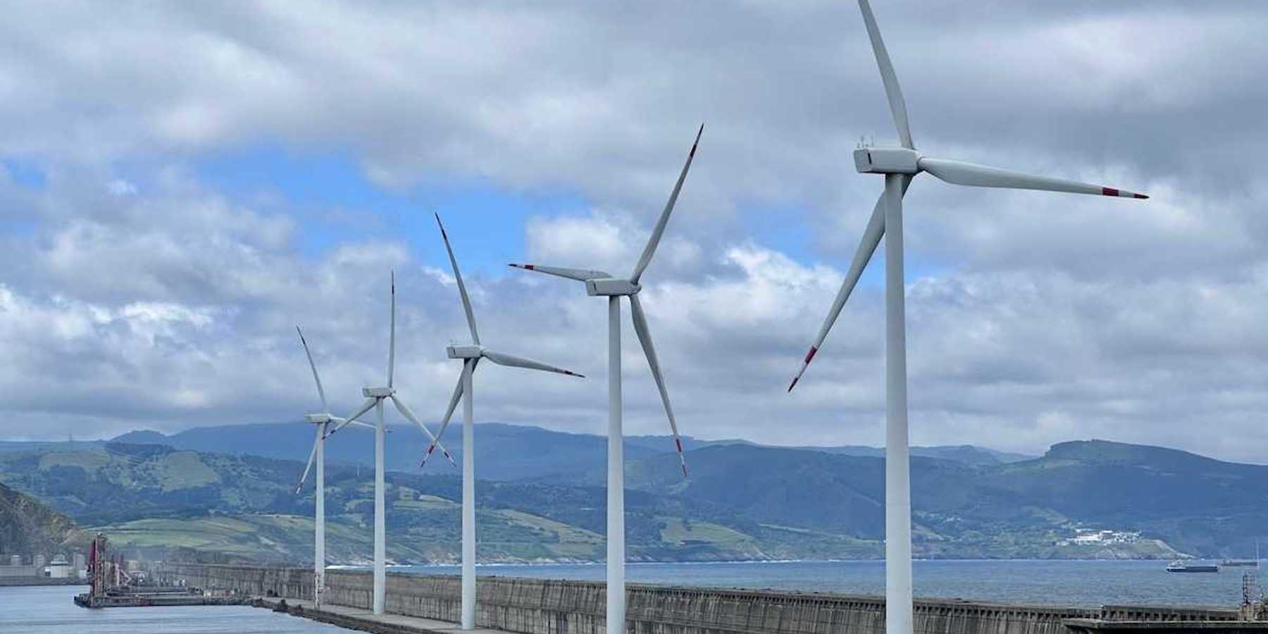 Spanish wind turbines operated by Acciona Energía, on the harbour wall at Bilbao.