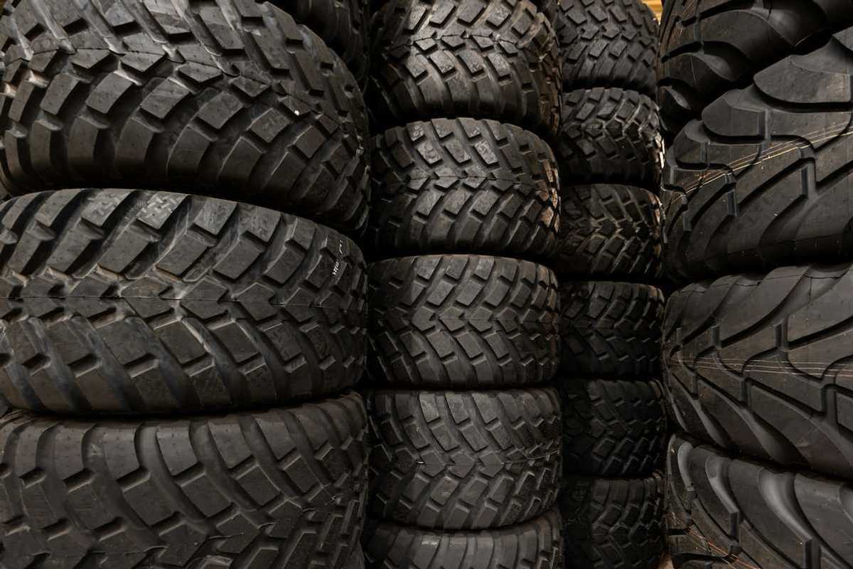 Stacks of car tires with varying tread patterns