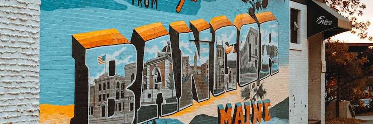 Street-level mural on a brick building in downtown Bangor, Maine