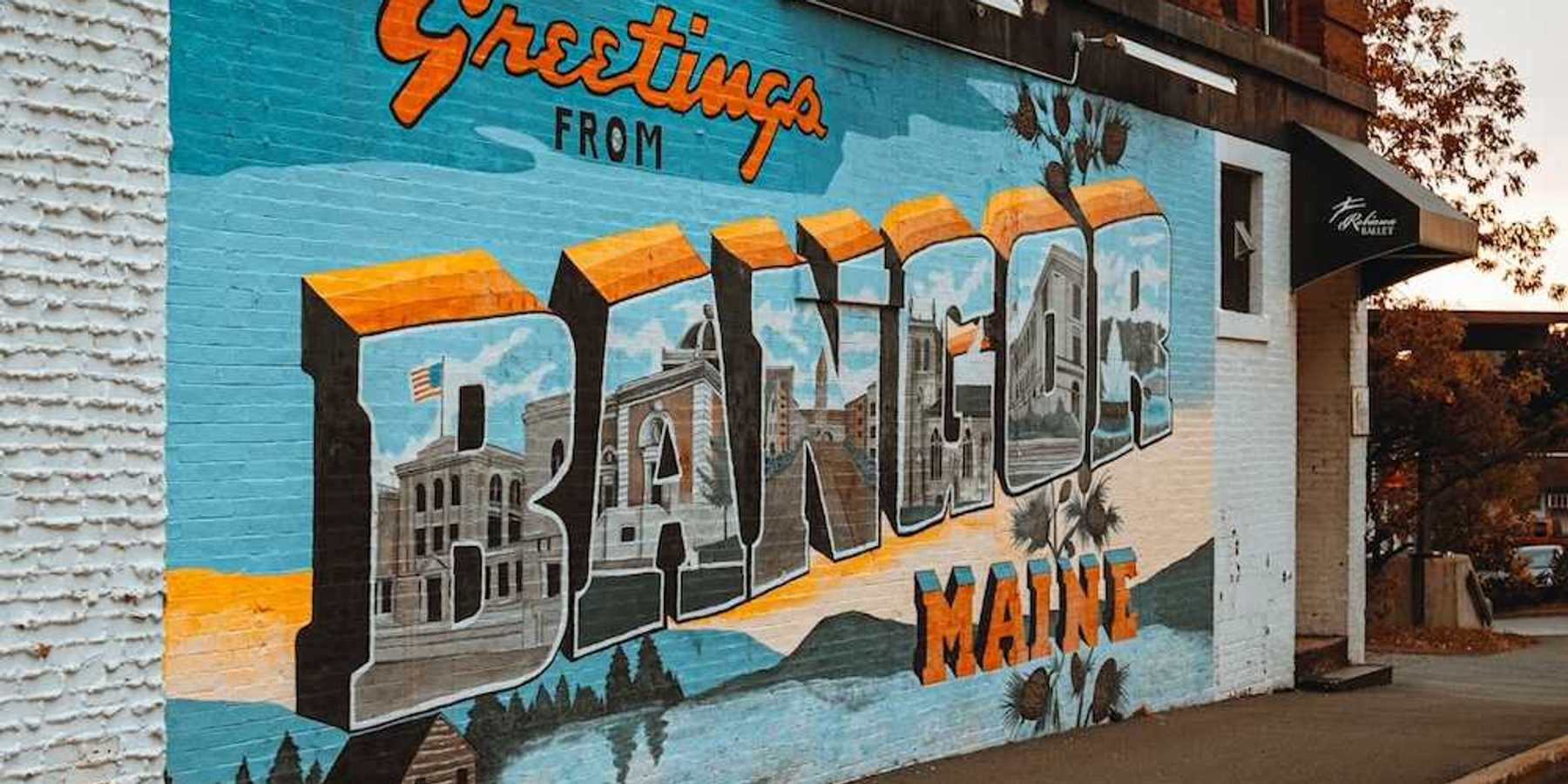 Street-level mural on a brick building in downtown Bangor, Maine