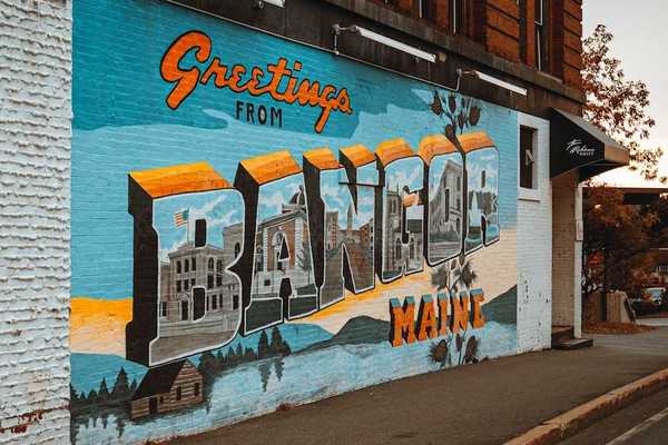 Street-level mural on a brick building in downtown Bangor, Maine