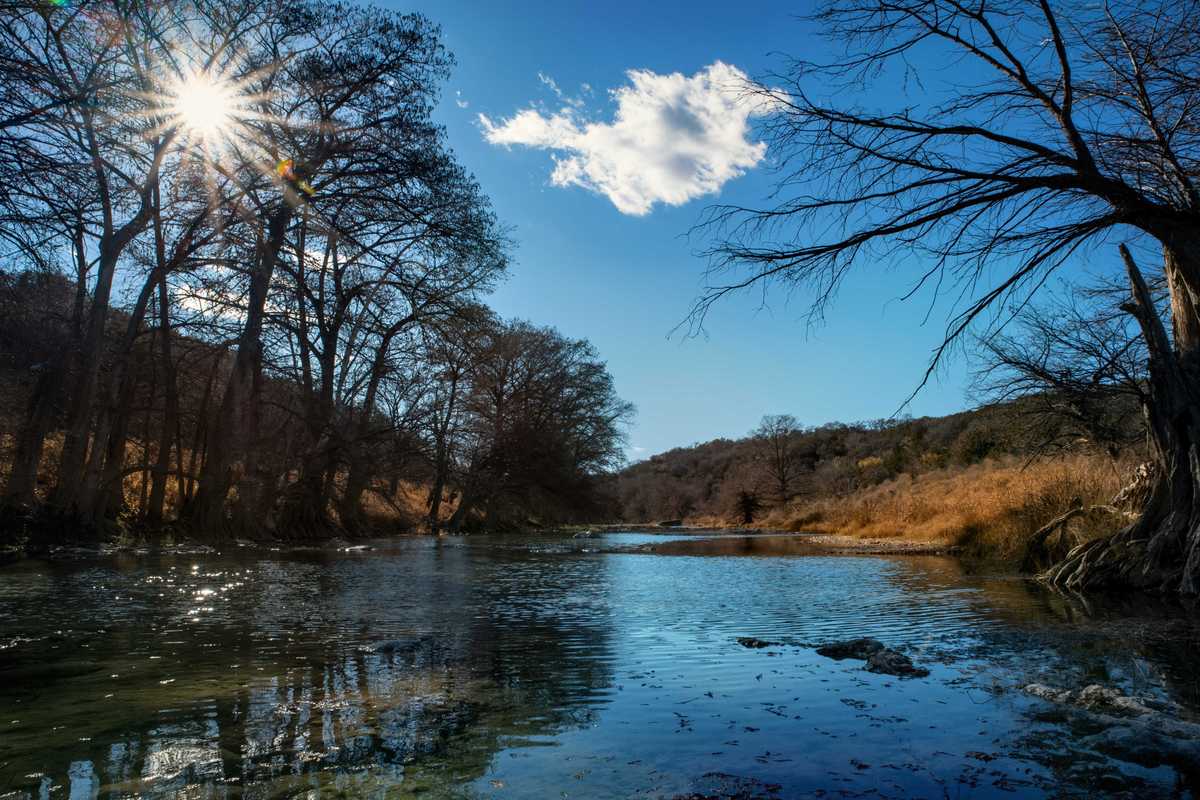 Sunlight shines over river bed