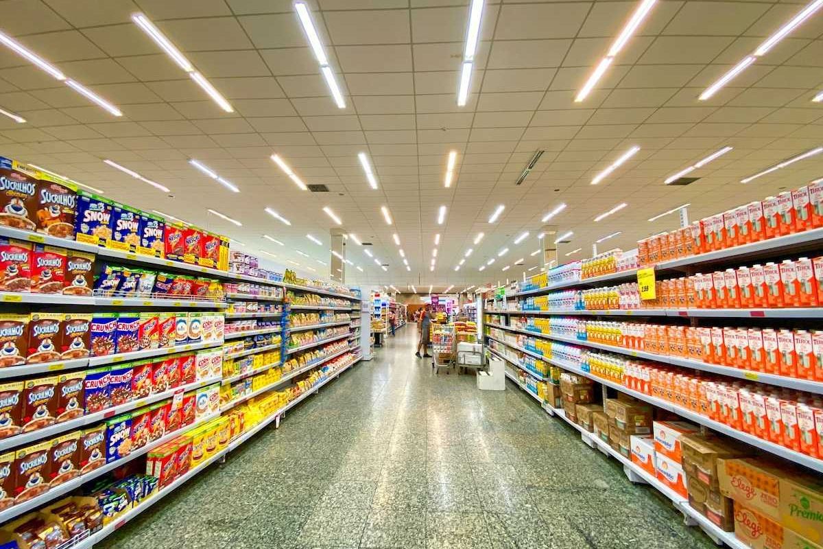 Supermarket aisle replete with massive selection of processed and ultra-processed food