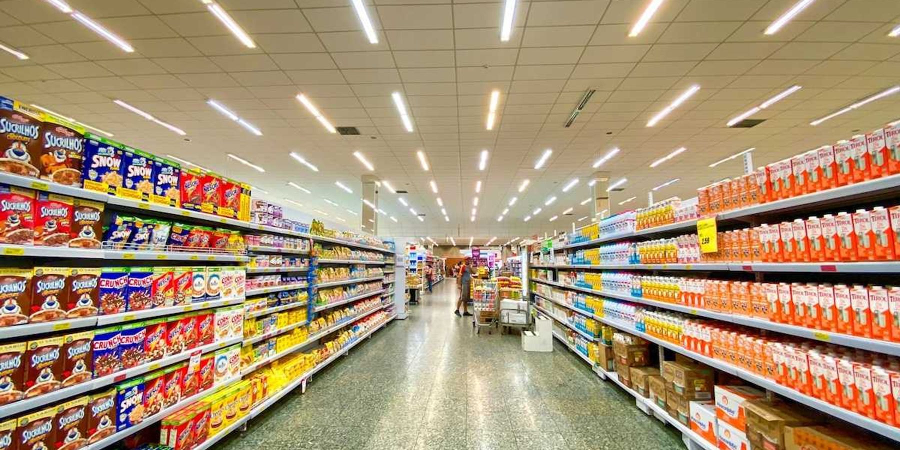 Supermarket aisle replete with massive selection of processed and ultra-processed food