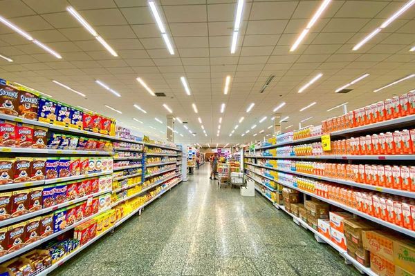 Supermarket aisle replete with massive selection of processed and ultra-processed food