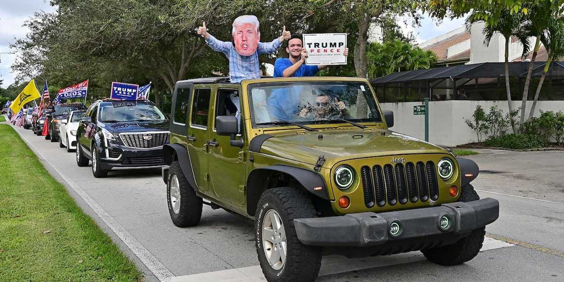 Supporters of President Donald Trump parade in cars and trucks in Miami, Florida