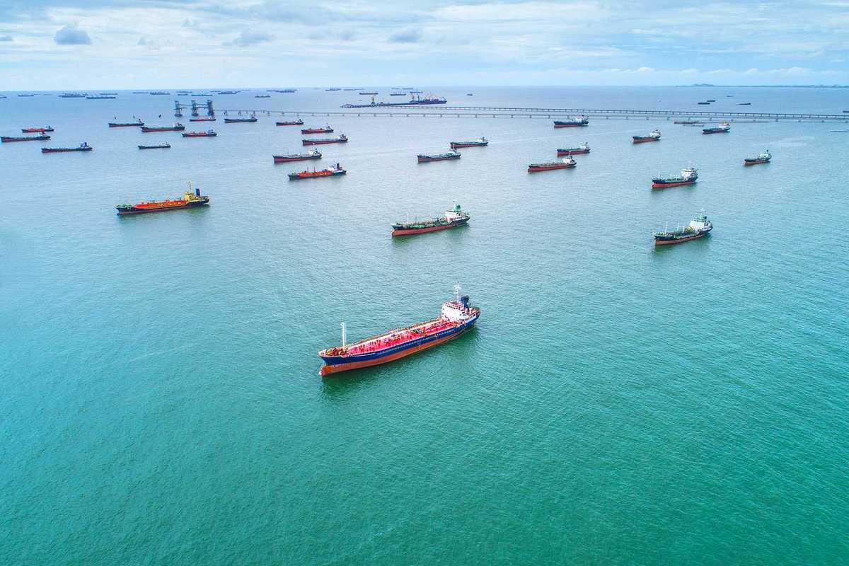 Tankers and cargo ships awaiting port access