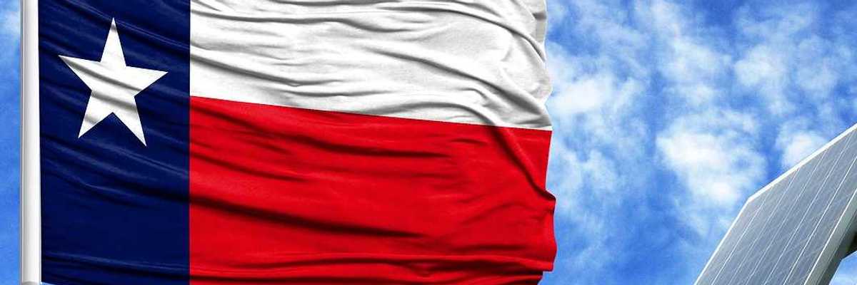 Texas flag flying adjacent to solar panel