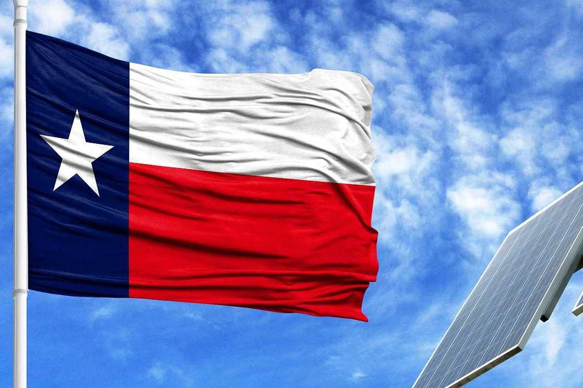 Texas flag flying adjacent to solar panel