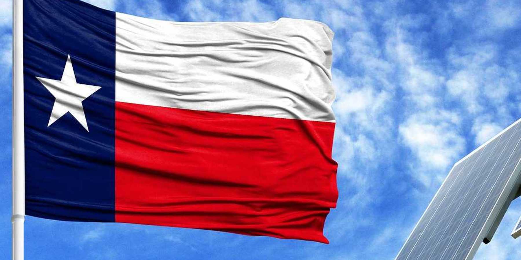 Texas flag flying adjacent to solar panel