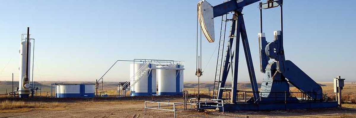 Texas oil and gas well with accompanying storage tanks