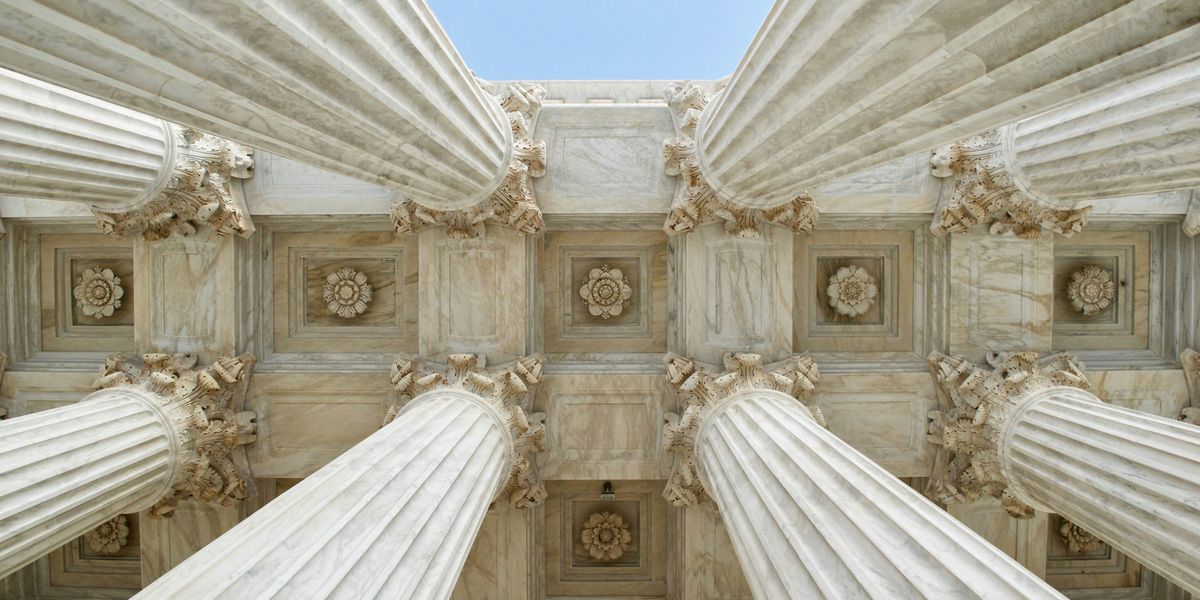 The columns of the Supreme Court viewed from below.