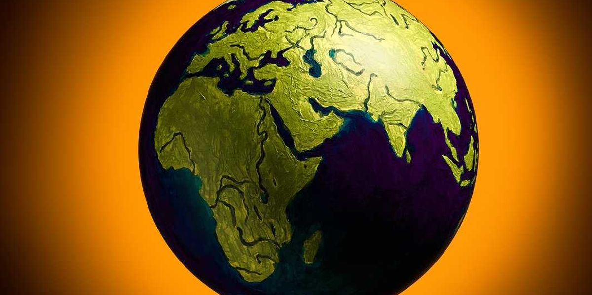 The concept of climate change. Planet earth on fiery orange background.