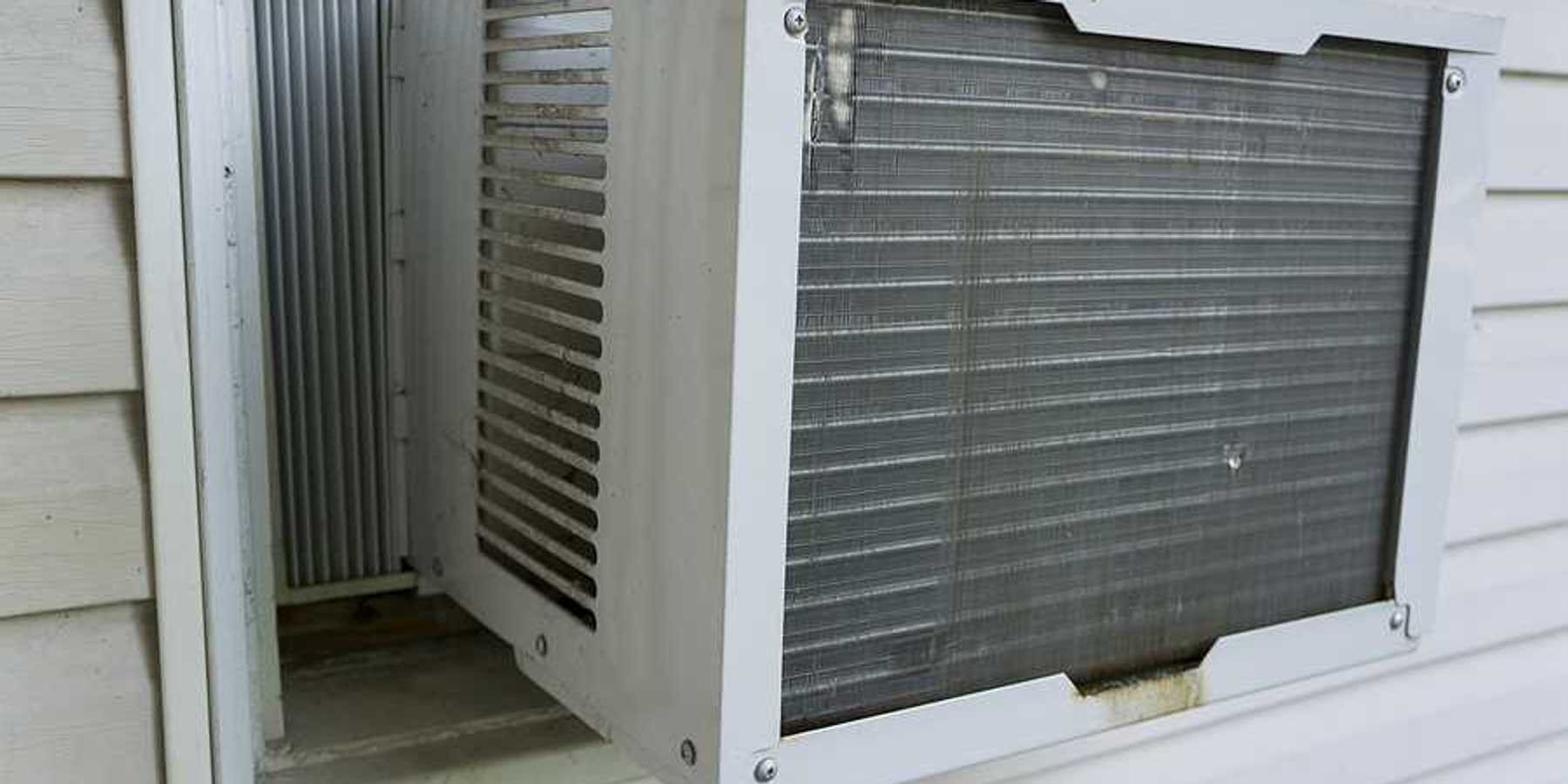 The exterior of a house with a window air conditioner installed