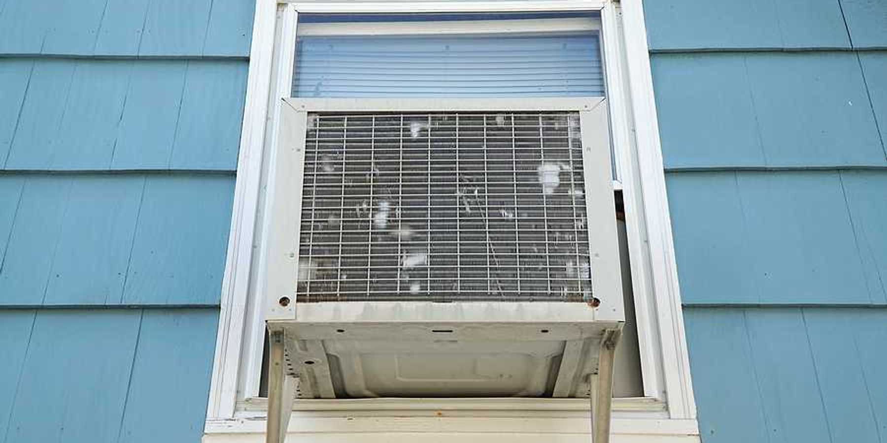 The exterior of a house with a window air conditioner installed