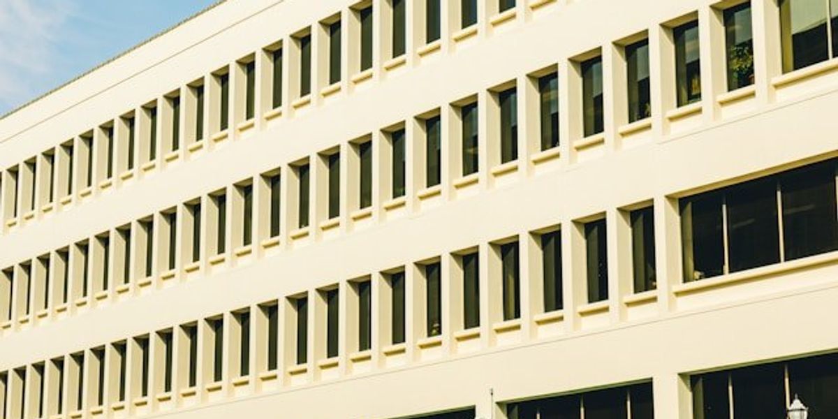 The exterior of a large office building.