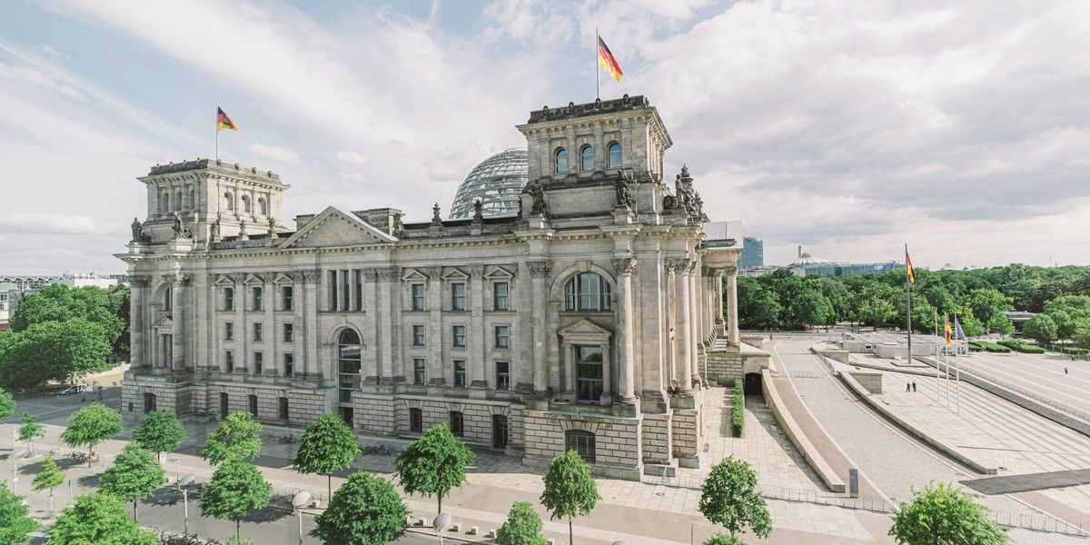 The German Reichstag building on a sunny day.