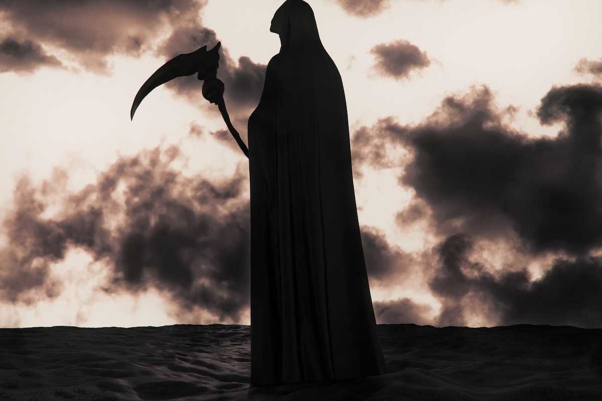 The Grim Reaper silhouetted against apocalyptic background