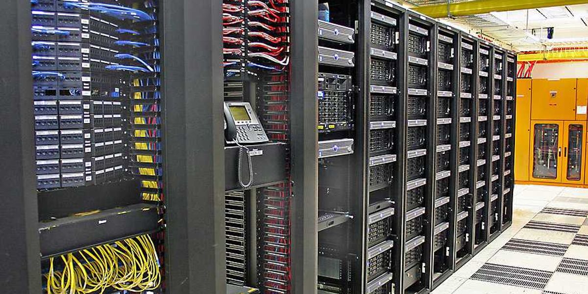 The interior of a data center with rows of computer servers