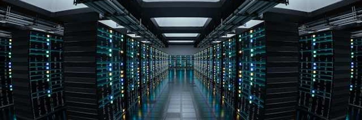 The interior of a data center with rows of servers stretching into the distance