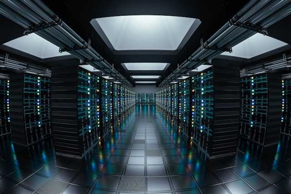 The interior of a data center with rows of servers stretching into the distance