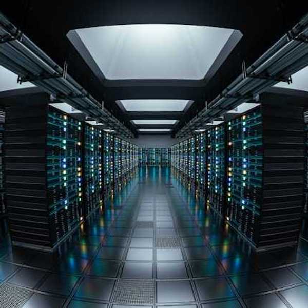 The interior of a data center with rows of servers stretching into the distance
