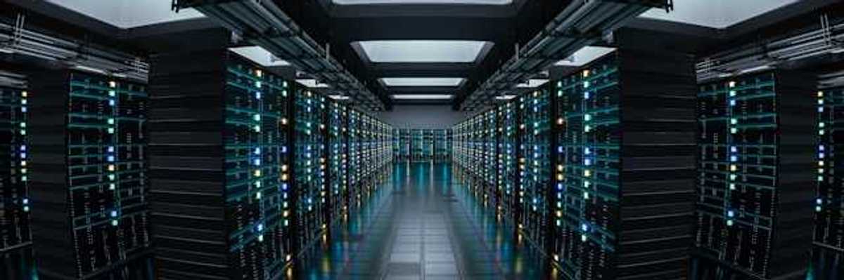 The interior of a data center with rows of servers stretching into the distance