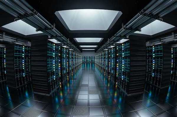 The interior of a data center with rows of servers stretching into the distance