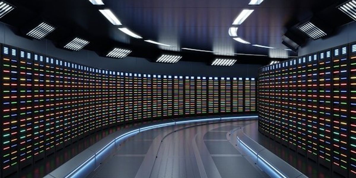 The interior of a data center with servers stretching into the distance.